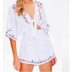 Never worn F21 size large white romper with embroidered flowers
